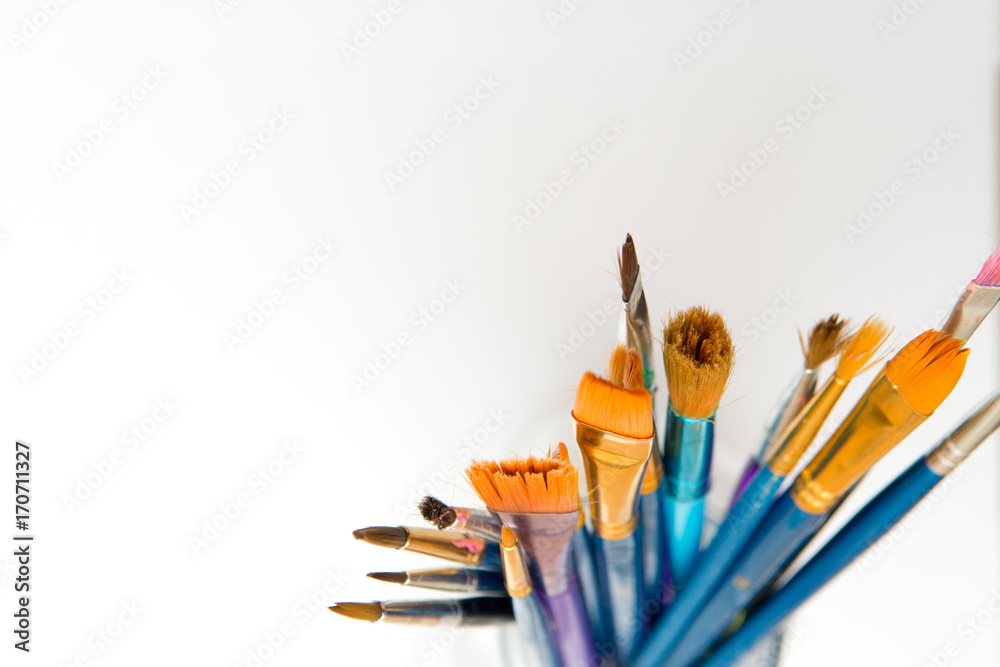 Paint brushes isolated, used artist tools with copy space Paint brushes isolated, used artist tools with copy space