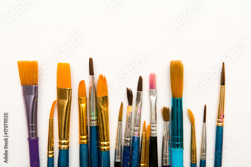 Paint brushes isolated, used artist tools with copy space