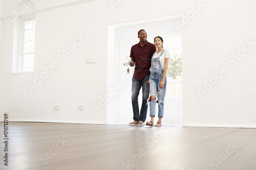 Excited Young Couple Moving Into New Home Together
