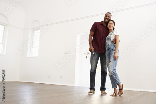Excited Young Couple Moving Into New Home Together © Monkey Business