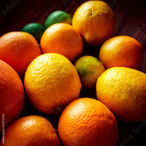 Sliced citrus fruits  vitamins  oranges  grapefruits  limes  juicy fruits background