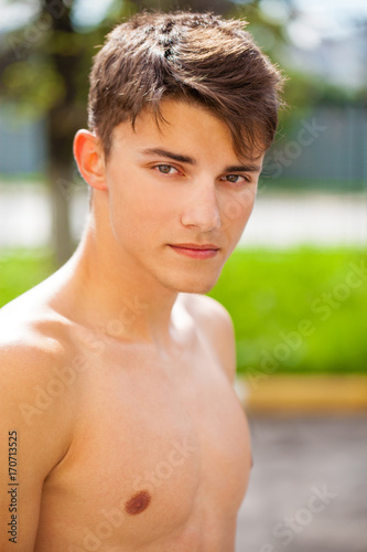 Portrait of a young guy with open shoulders