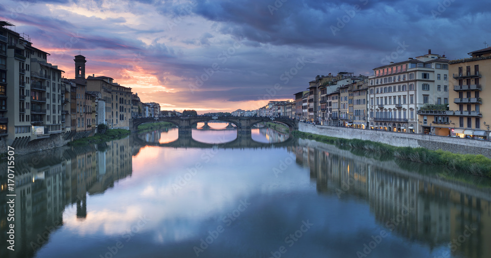 Last lights in sky above river in Florence in Italy