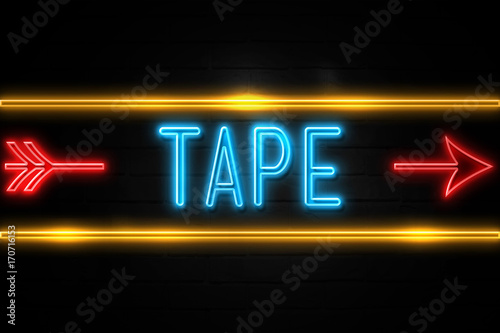 Tape  - fluorescent Neon Sign on brickwall Front view
