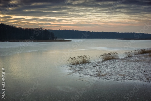 Sunset over frozen lake Kirsajty on Masuria  Poland