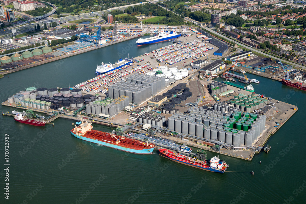 Ships docked at oil and container shipping terminals in the Port of Rotterdam.
