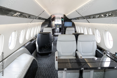 Fototapeta Modern business jet aircraft interior cabin view.