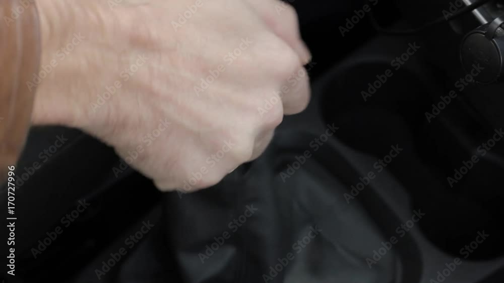 manual gear shift knob on a vehicle. hand of driver, driving car shifting gears