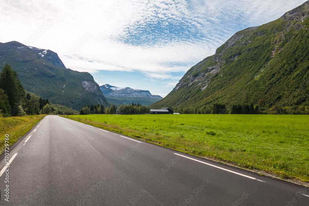Naklejka premium Panorama of summer landscape in Norway - river, stones, mountings