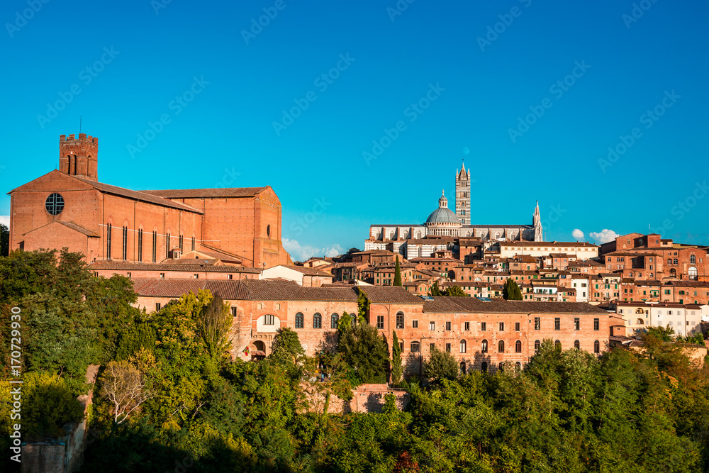 Secenery of Siena, a beautiful medieval in Tuscany, Italy with view of the Dome and Bell Tower of Siena Cathedral 