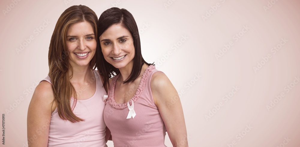 Composite image of smiling women in pink outfits posing for Composite image of smiling women in pink outfits posing for
