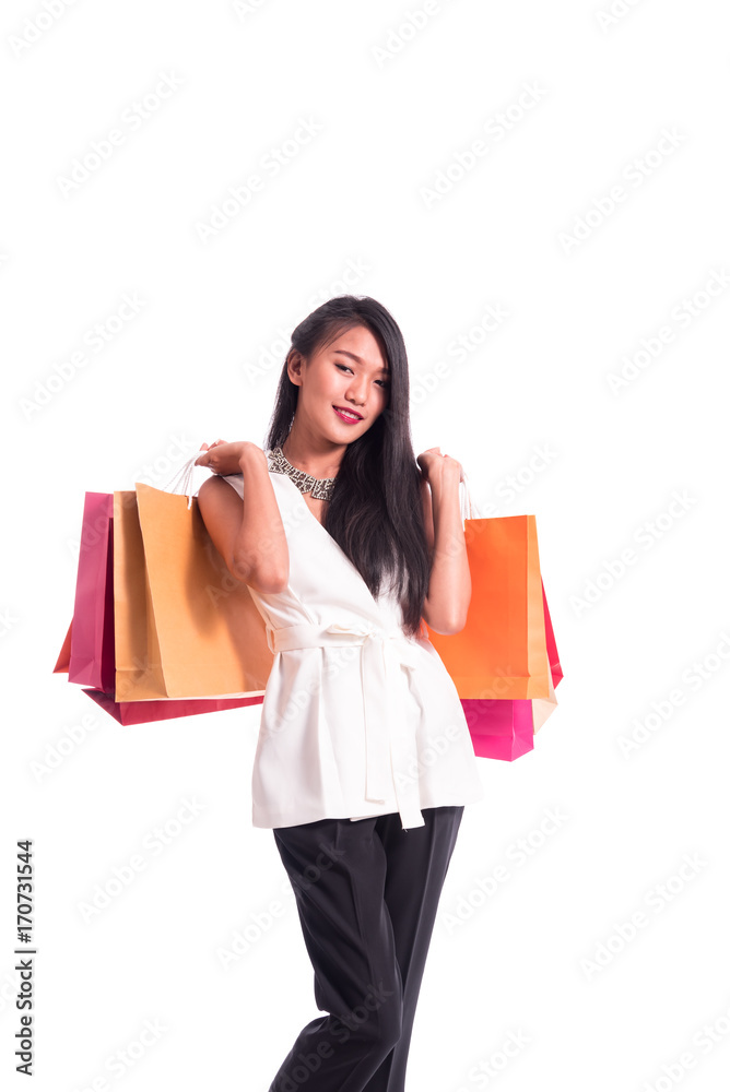 Cheerful shopping woman of Asian holding bags. Shopping smart business woman happy smiling holding colorful shopping bags isolated on white . Fresh young Asian female model Cheerful shopping woman of Asian holding bags. Shopping smart business woman happy smiling holding colorful shopping bags isolated on white . Fresh young Asian female model