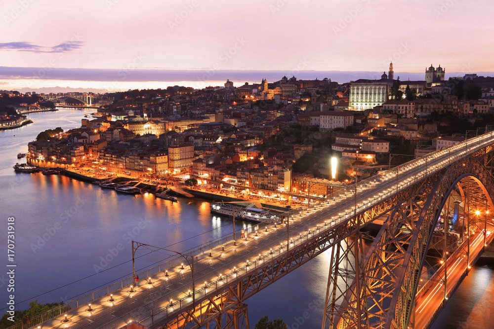 Porto skyline and Douro River at dusk with Dom Luis I Bridge on the foreground, Portugal