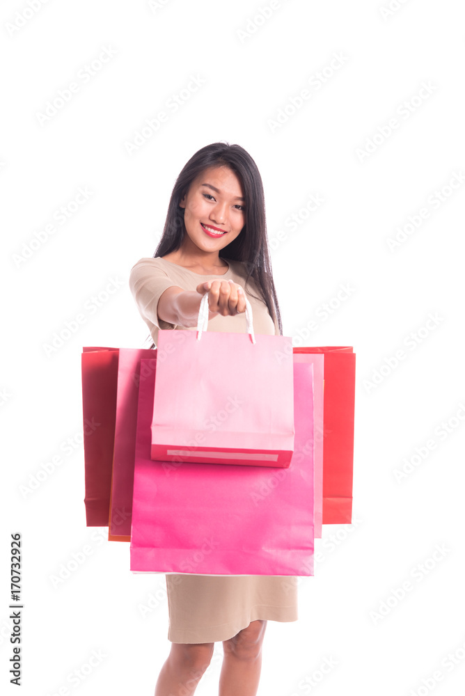 Cheerful shopping woman of Asian holding bags. Shopping smart business woman happy smiling holding colorful shopping bags isolated on white . Fresh young Asian female model Cheerful shopping woman of Asian holding bags. Shopping smart business woman happy smiling holding colorful shopping bags isolated on white . Fresh young Asian female model