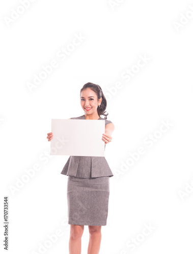 Portrait of young business woman smiling with the white poster with space for text and message,isolated on white in studio