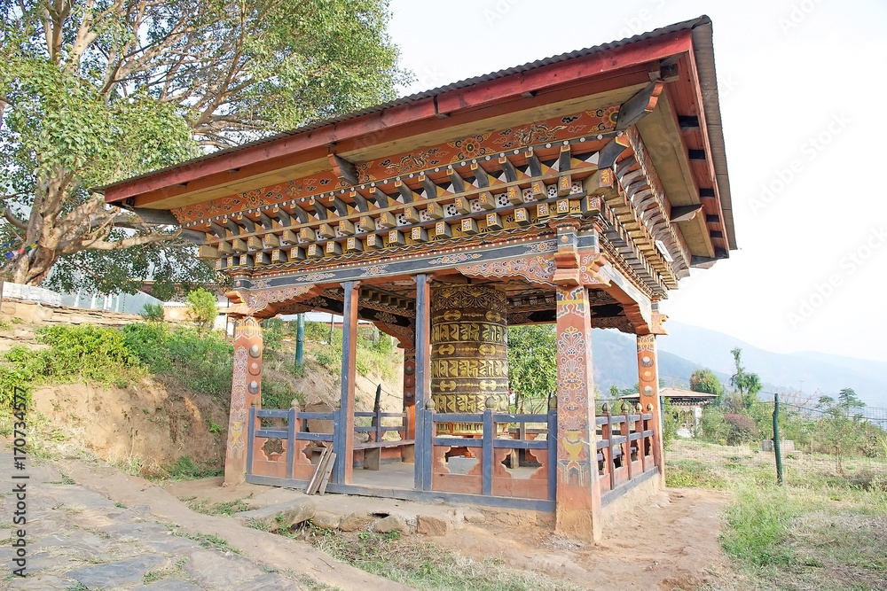 Prayer wheel at the Chimi Lhakang Monastery, Punakha, Bhutan Prayer wheel at the Chimi Lhakang Monastery, Punakha, Bhutan