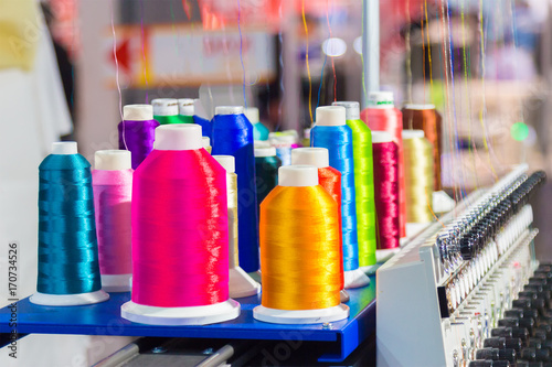Coils of threads for sewing machines