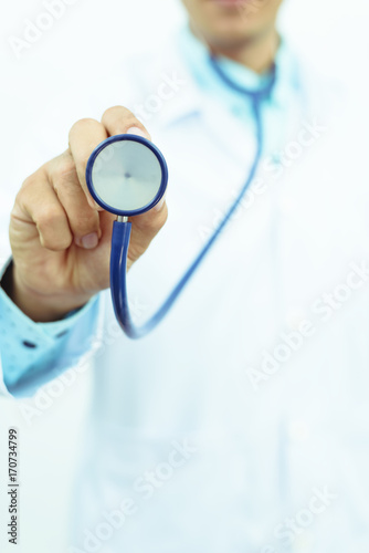 closed up of hand with stethoscope ,isolated on white