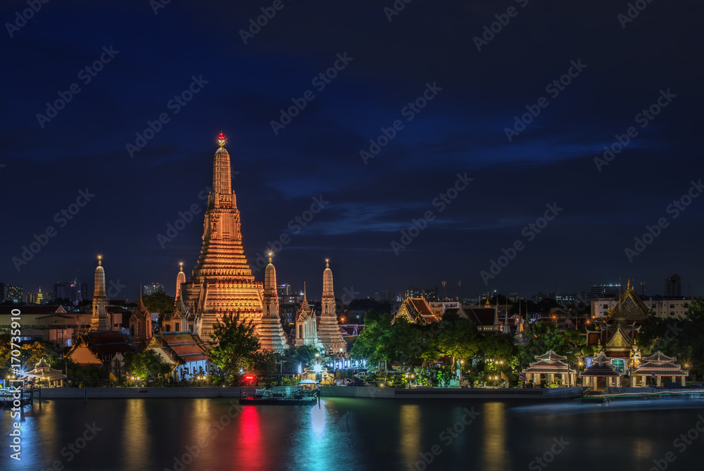 Fototapeta premium Temple of Dawn or Wat Arun after renovation at twilight in Bangkok, Thailand