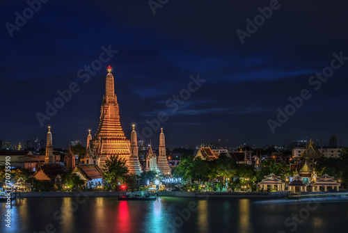 Temple of Dawn or Wat Arun after renovation at twilight in Bangkok, Thailand