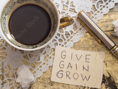 cup of coffee with motivation quote photo