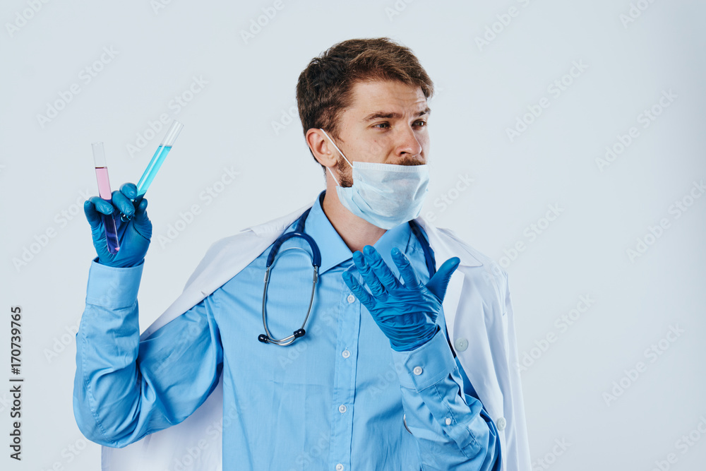 man in a medical mask, laboratory glassware man in a medical mask, laboratory glassware