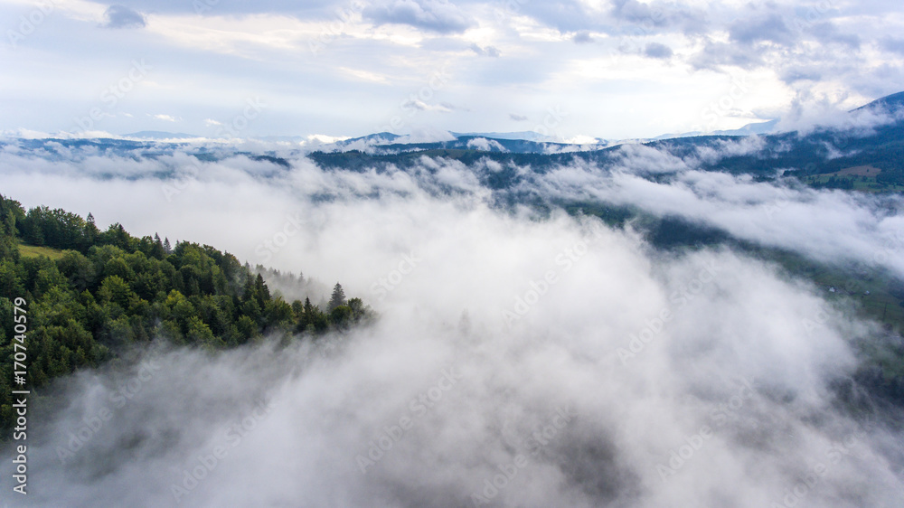 Aerial view of beautiful mountain landscape in foggy morning