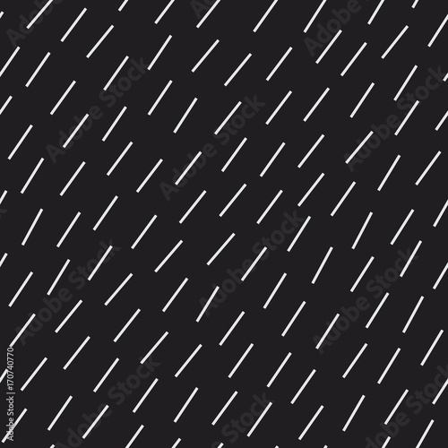 Diagonal short dash lines seamless vector pattern. Repeated simple background for print, textile, web use. Rain, hair, or grass texture.