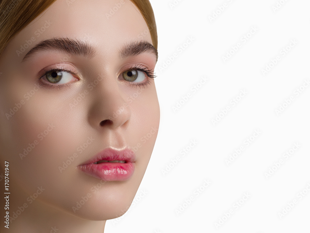 The beautiful blonde the woman with sensual lips and green eyes. Gently pink gloss of lips and pure leather represents health and beauty of fashion. Care of skin, Spa, cosmetology