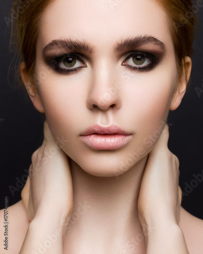 Beautiful sexy young women with evening cosmetics  dense eyebrow
