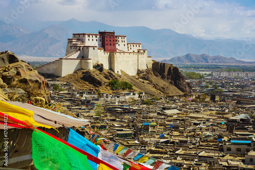 Panchen Lama residency called Little Potala in Shigatse city, Tibet, China. Cityscape from old buddhist monastery. photo
