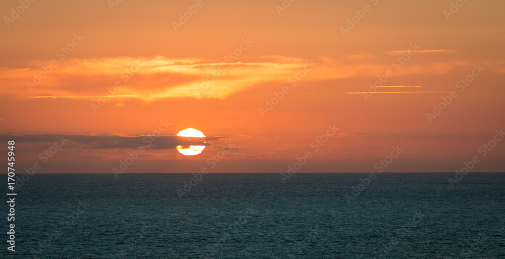 Sun setting over the pacific ocean