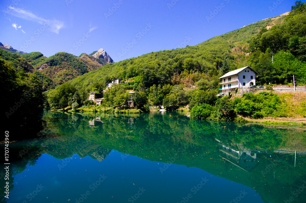 mountain lake with small hamlet and historic church