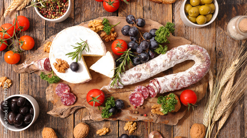 composition of charcuterie,cheese,olive and fruits