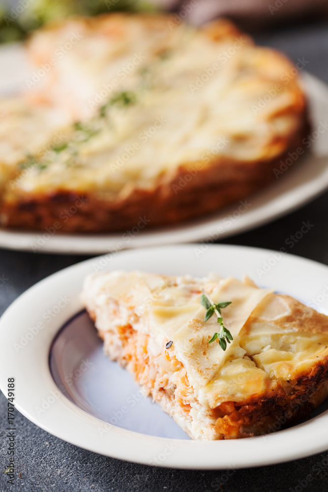 Fresh round fish pie on dark background Fresh round fish pie on dark background