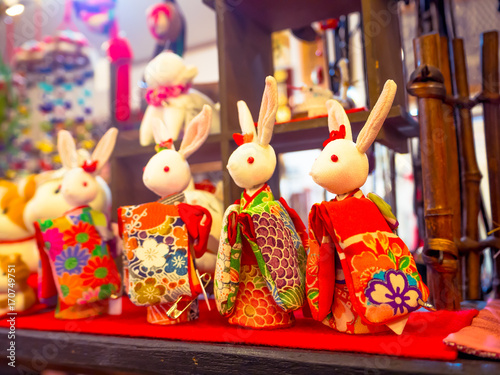 HAKONE, JAPAN - JULY 02, 2017: Japanese traditional japanesse dolls on a blurred background mass-produced products. Selective focus in a store in hanami Kyoto