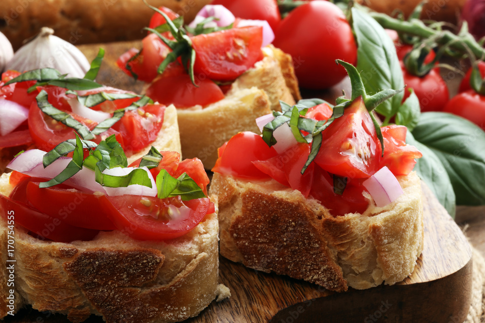 Bruschetta with tomatoes, herbs and oil on toasted garlic cheese bread toasted with chopped tomatoe