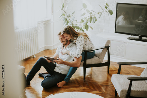 Couple using digital tablet...