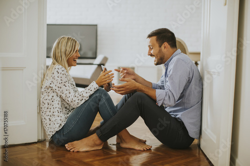 Young loving couple sitting...