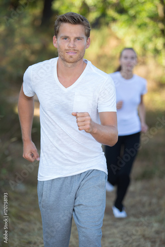 young couple running