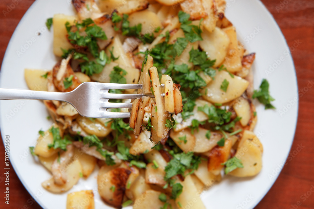 Fried potatoes with bacon and parsley V
