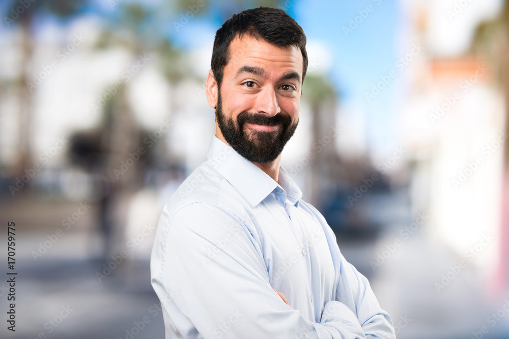 Handsome man with beard on unfocused background Handsome man with beard on unfocused background
