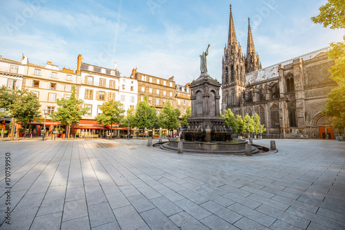 Morning view on the Victory square with monument and cathedral in Clermont-Ferrand city in France photo