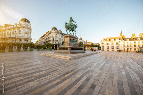 View on the Martroi square with statue of Saint Joan of Arc in Orleans city during the sunset in France photo