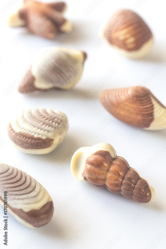 Chocolate candies on the white background