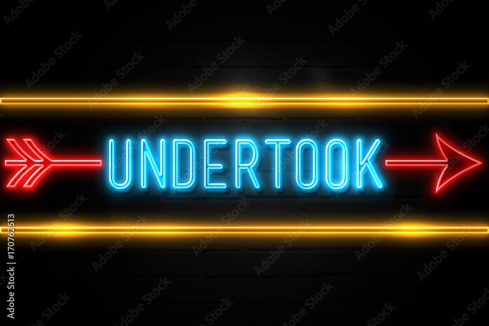 Undertook  - fluorescent Neon Sign on brickwall Front view