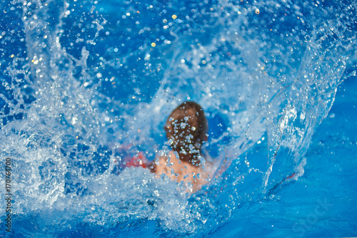 Splashes in the swimming pool. © Artem