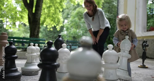 Mother and child playing chess