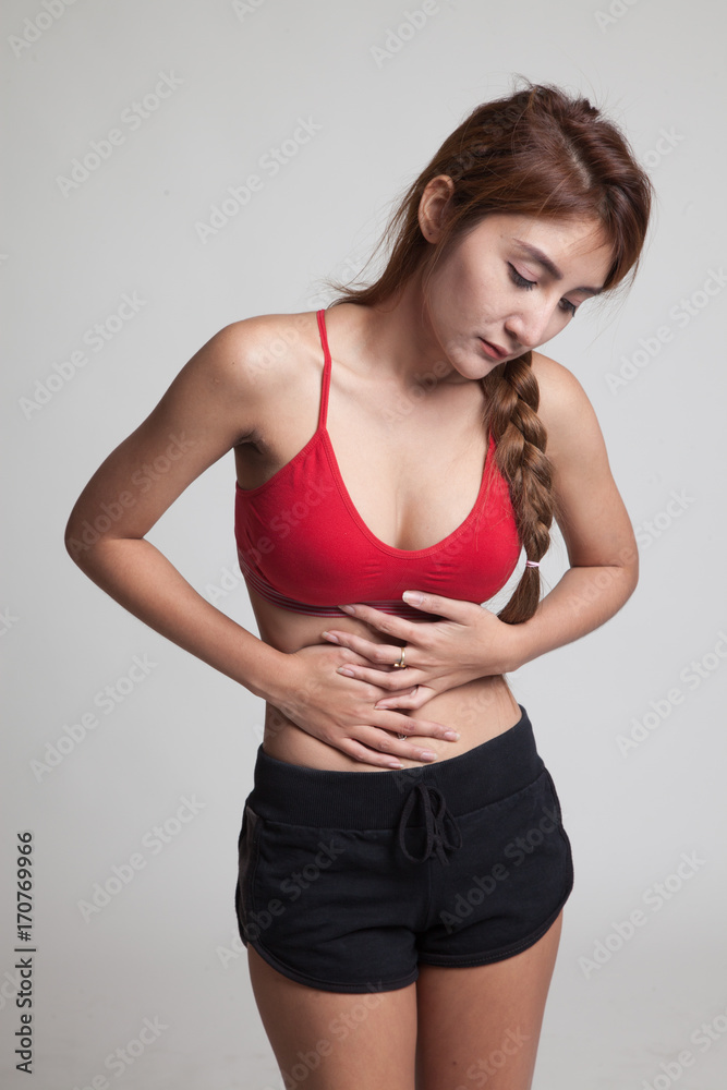 Asian healthy girl got stomachache.