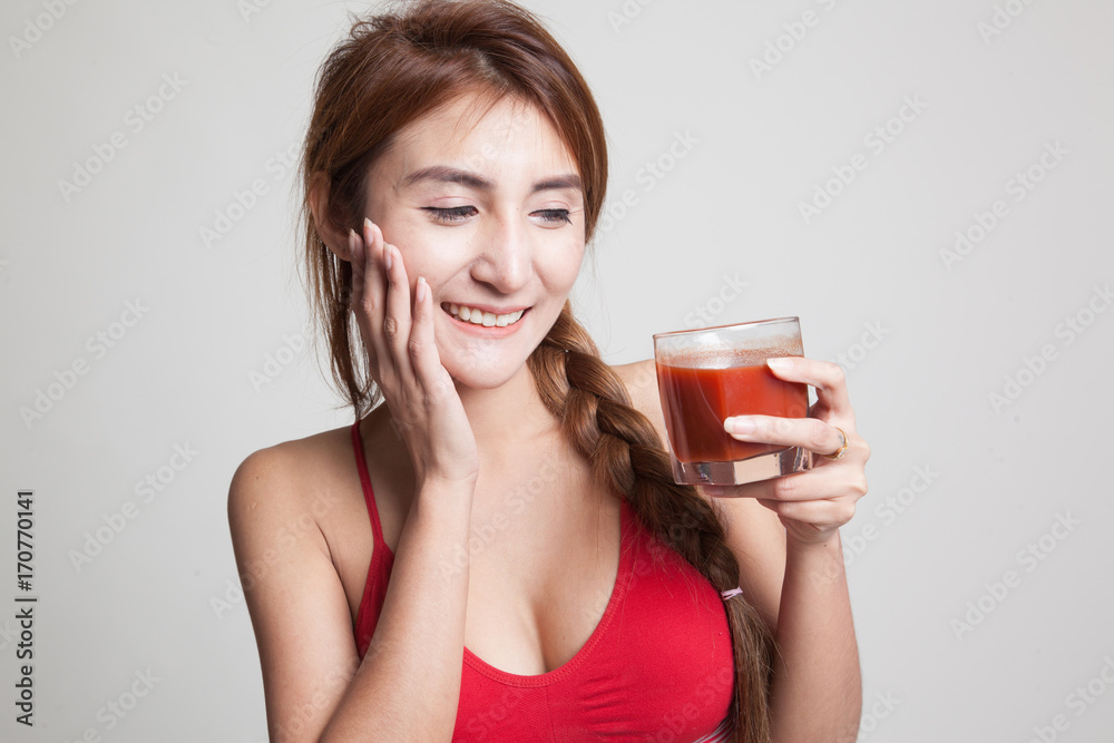 Beautiful healthy Asian girl like tomato juice. Beautiful healthy Asian girl like tomato juice.